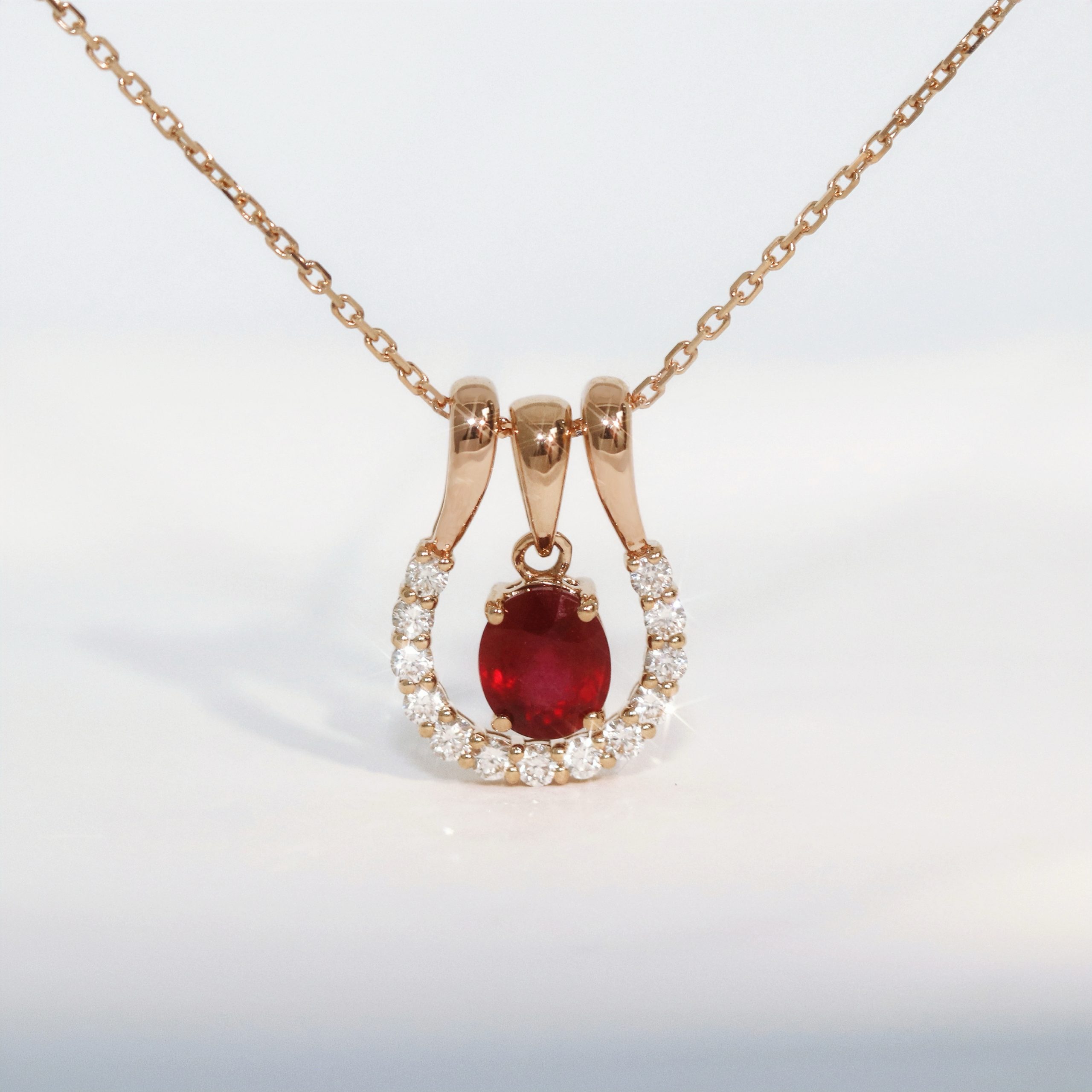 Oval cut Ruby Horseshoe Diamond Necklace